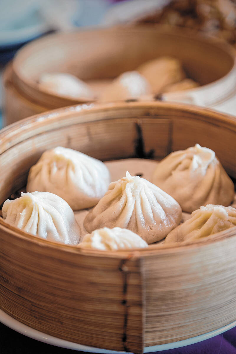 Traditional soup dumpling Xiao Long Bao is a popular Chinese dim sum steamed in bamboo steamers.