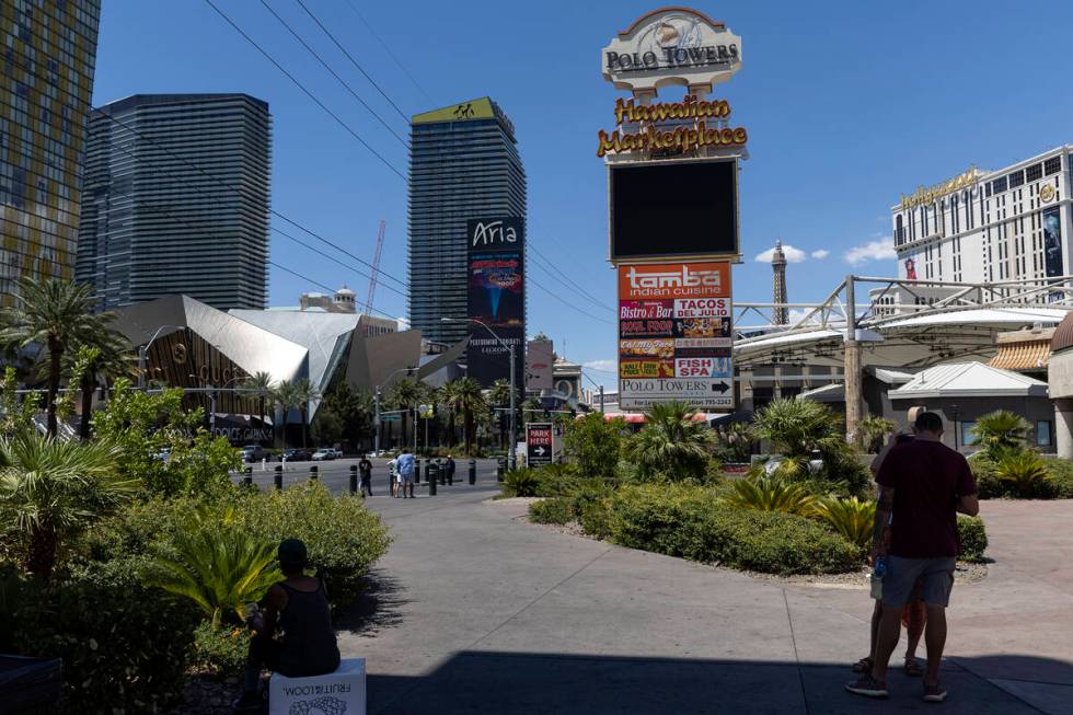 The sign for Hawaiian Marketplace is seen among hotel-casino high rises, Wednesday, June 29, 20 ...