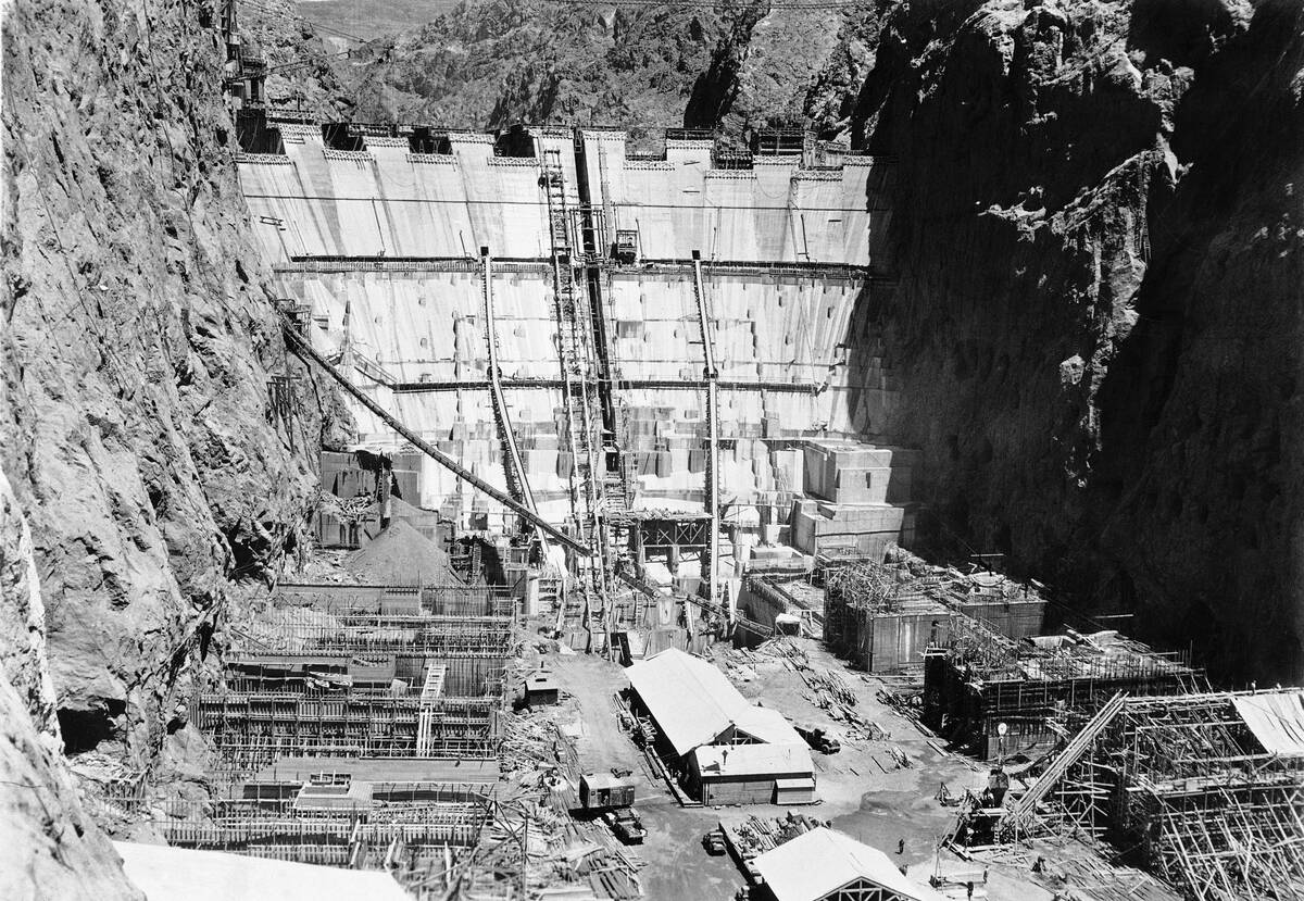 In this U.S. Bureau of Reclamation photo, construction gangs on the great Boulder Dam, who work ...