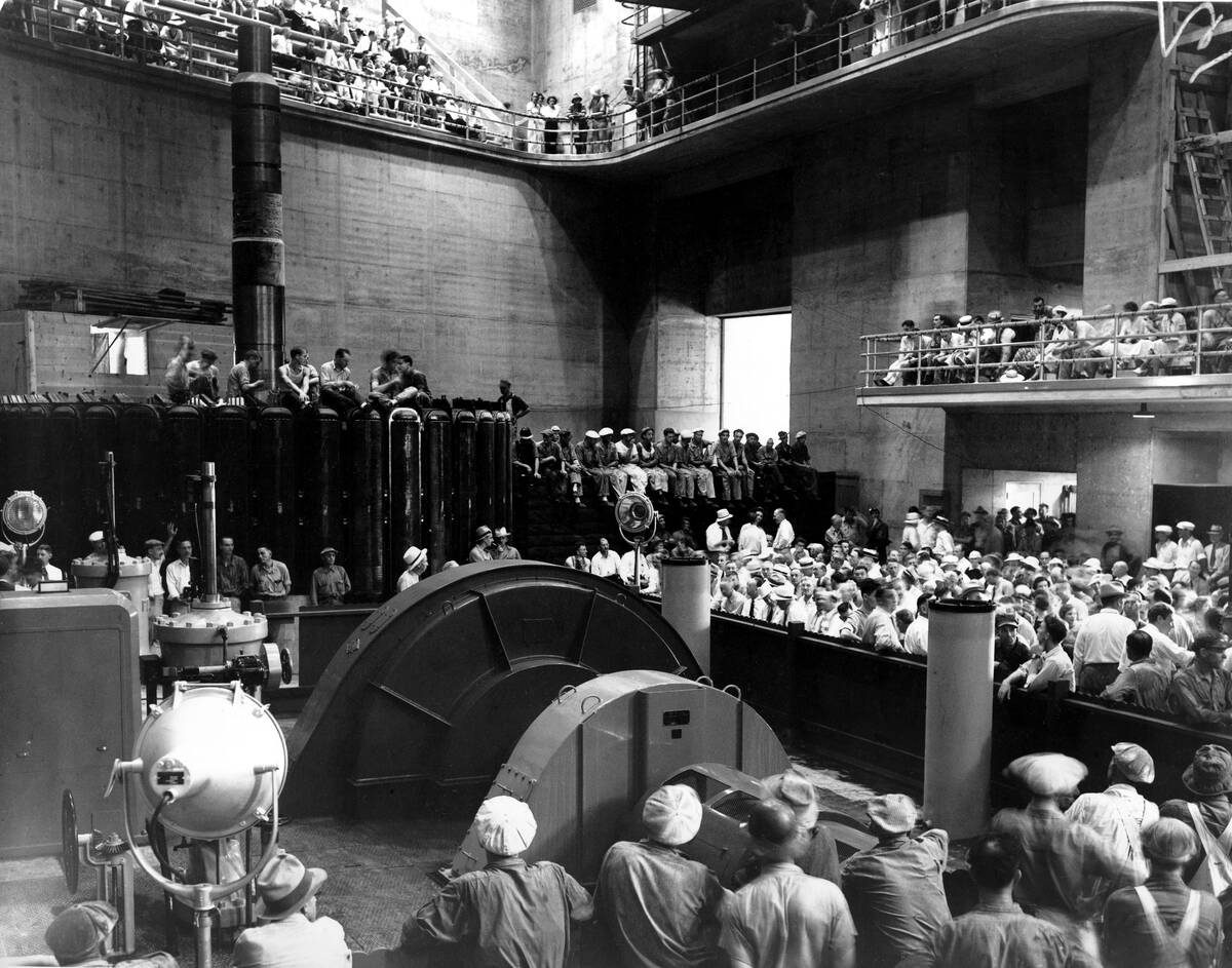 A crowd is assembled in the power house of the Hoover Dam in Boulder City, Nev., during ceremon ...