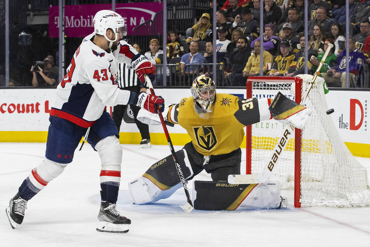 Golden Knights goaltender Logan Thompson (36) makes a save against Washington Capitals right wi ...