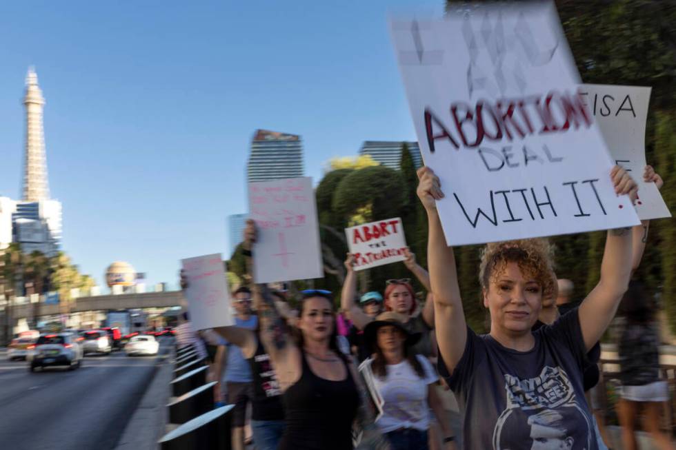 A rally for women’s rights makes way down Las Vegas Boulevard, Friday, July 1, 2022, on ...