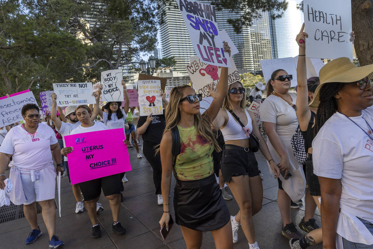 Pro-abortion marchers travel on Las Vegas Boulevard during rally for women’s rights at t ...