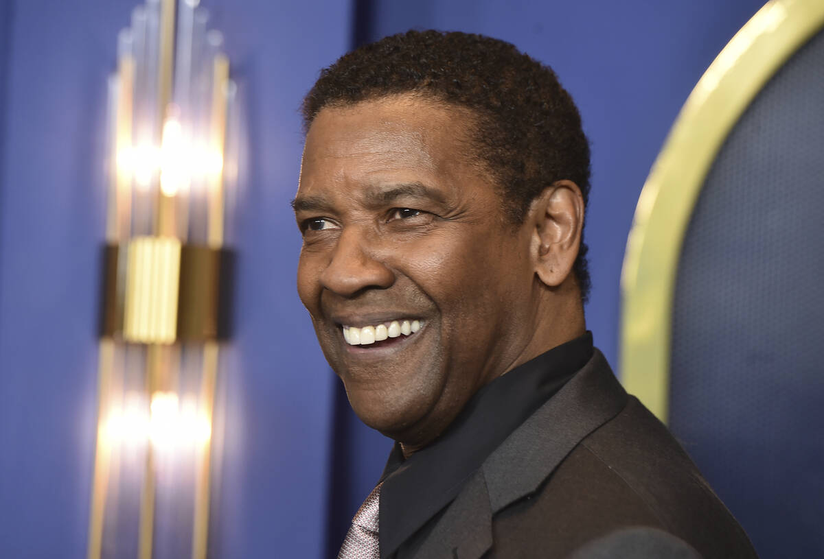 FILE - Denzel Washington arrives at the 94th Academy Awards nominees luncheon, March 7, 2022, i ...