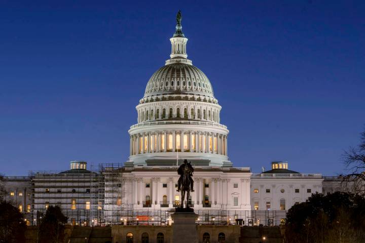 FILE - The U.S. Capitol building is seen before sunrise on Capitol Hill in Washington, Monday, ...