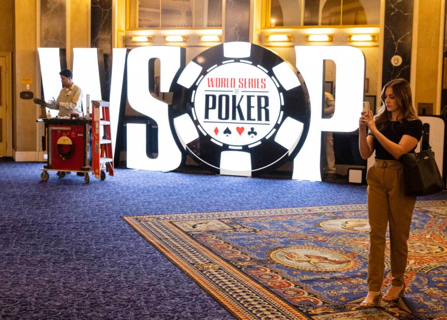 David Hemby, a carpenter, installs the WSOP sign at Paris Las Vegas hotel-casino on Thursday Ma ...