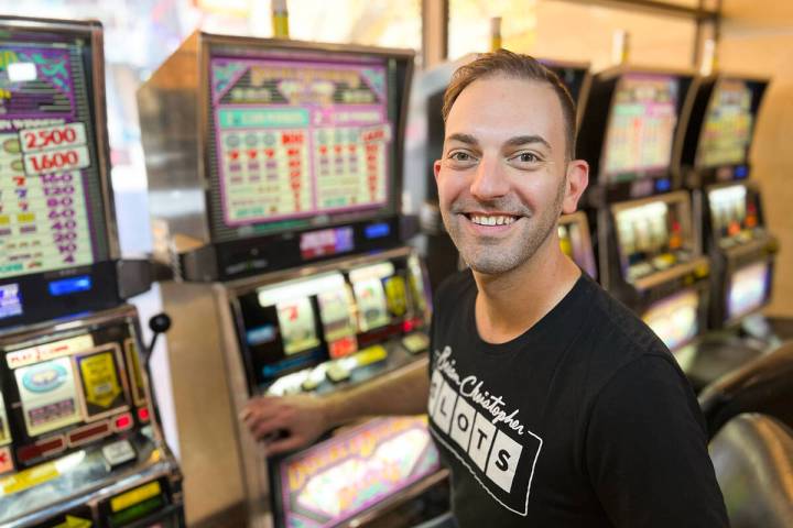 Brian Christopher poses at a slot machine bank. (Photo courtesy of Brian Christopher Slots)