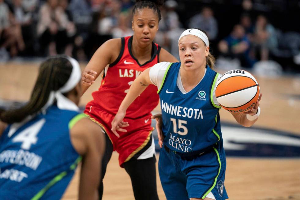 Minnesota Lynx guard Rachel Banham (15) drives against the Las Vegas Aces during a WNBA basketb ...