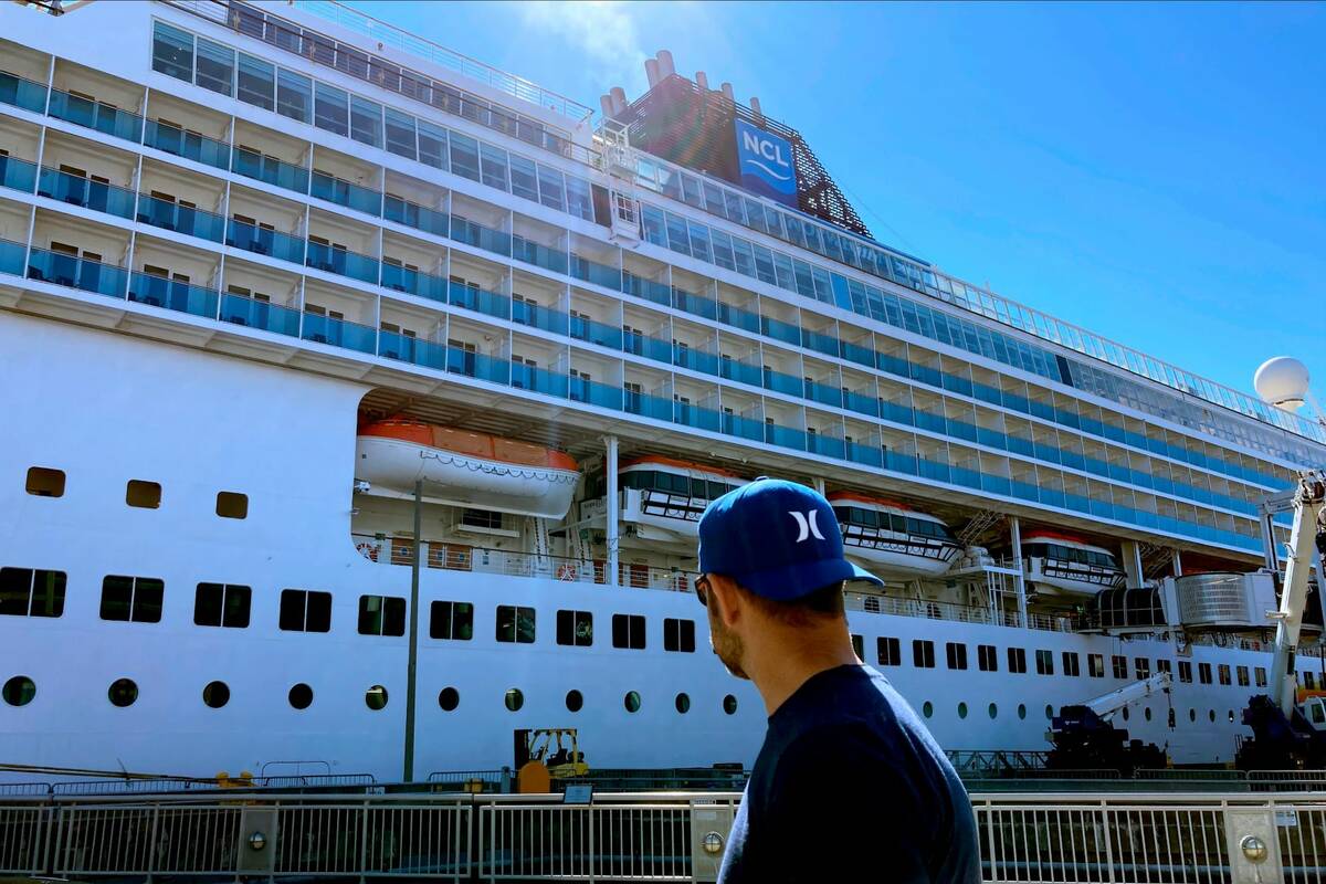 A man walks by the Norwegian Sun docked in Seattle on Tuesday June 30, 2022. The ship is in Sea ...