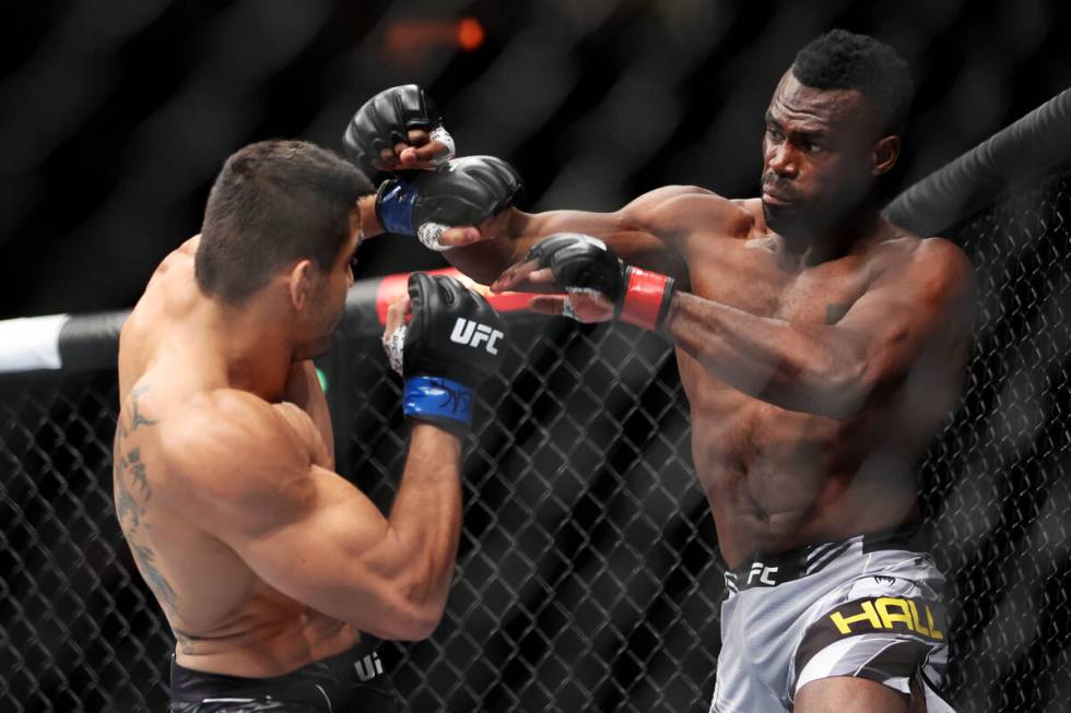Andre Muniz, left, and Uriah Hall, battle during the first round in a middleweight bout at T-Mo ...