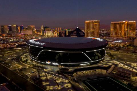 Aerial view of Allegiant Stadium and the Las Vegas Strip at dusk on Thursday, January 6, 2022. ...