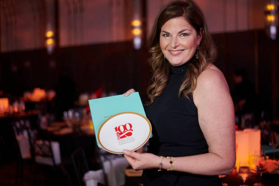 Las Vegas restaurateur Elizabeth Blau takes a moment with the commemorative plate given to gues ...