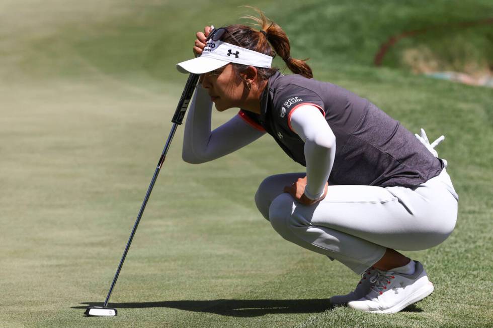 Alison Lee lines up her putt shot on the ninth hole during the second day of round-robin in the ...