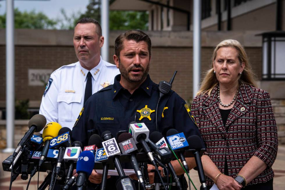 Highland Park Police Chief Louis Jogmen and Mayor Nancy Rotering look on as Deputy Chief Christ ...