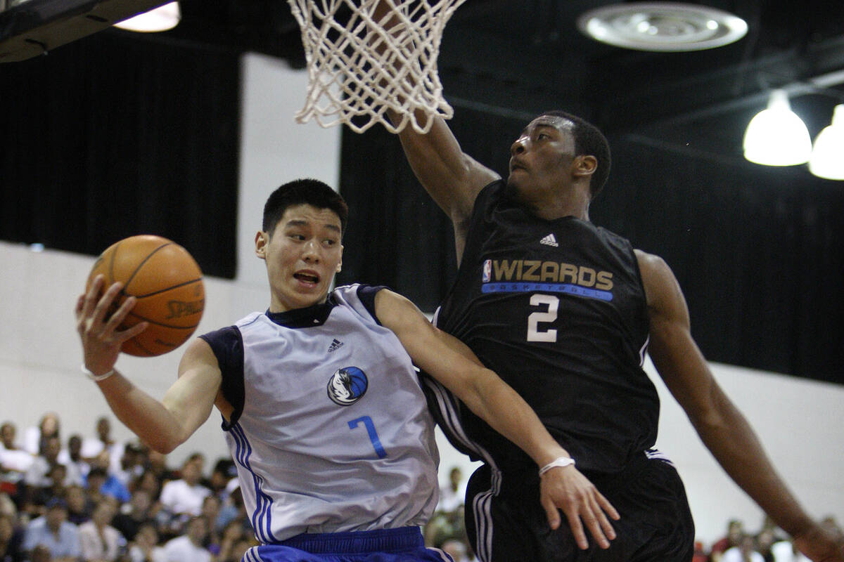 Dallas Mavericks basketball player Jeremy Lin of the Mavericks goes up for a shot against Washi ...