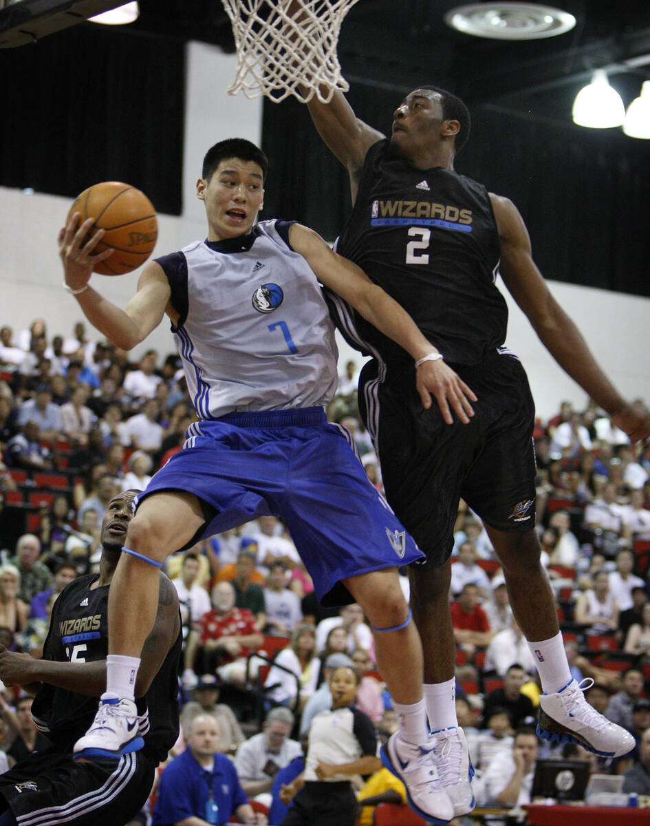 Dallas Mavericks basketball player Jeremy Lin of the Mavericks goes up for a shot against Washi ...