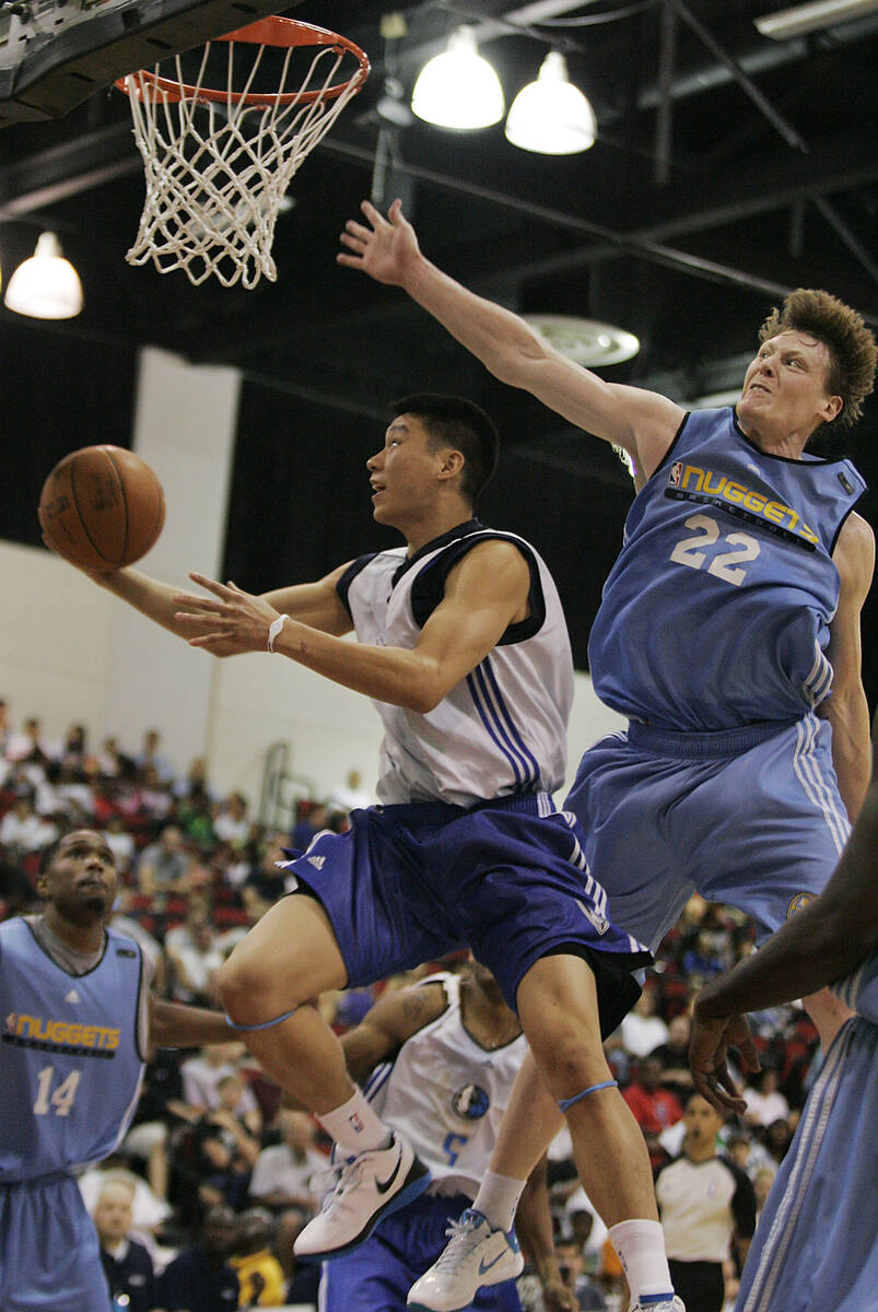 Dallas Mavericks' Jeremy Lin drives for a lay up past Denver's Coby Karl during the NBA Summer ...