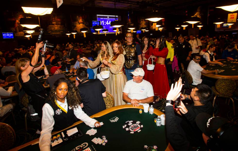 Actor and World Series of Poker master of ceremonies Vince Vaughn walks by tables during the WS ...