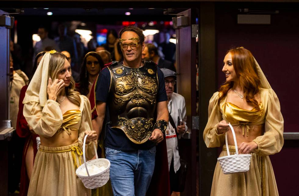 Actor and World Series of Poker master of ceremonies Vince Vaughn is escorted during the WSOP M ...
