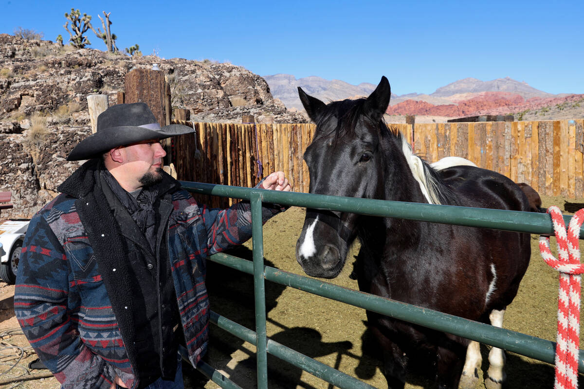 Mike Flood, general manager of Cowboy Trail Rides in Red Rock Canyon, visits with Oreo in Janua ...