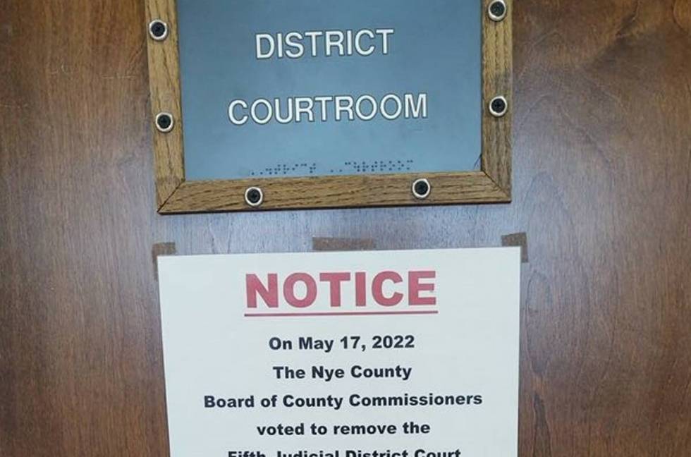 A sign was posted on a courthouse door in Nye County announcing court for the day was canceled. ...