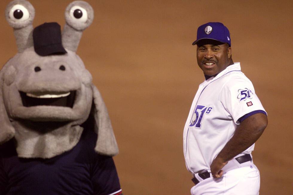 Las Vegas 51s first base coach Ron "Papa Jack" Jackson visits with Cosmo the mascot as the 51s ...