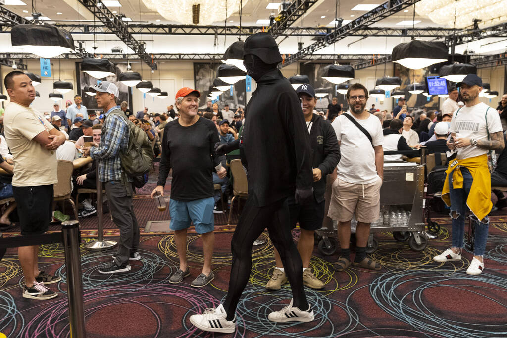 Phil Hellmuth makes his grand entrance to the World Series of Poker tournament dressed in a Dar ...