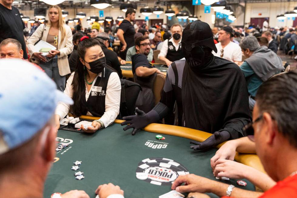 Phil Hellmuth makes his grand entrance to the World Series of Poker tournament dressed in a Dar ...