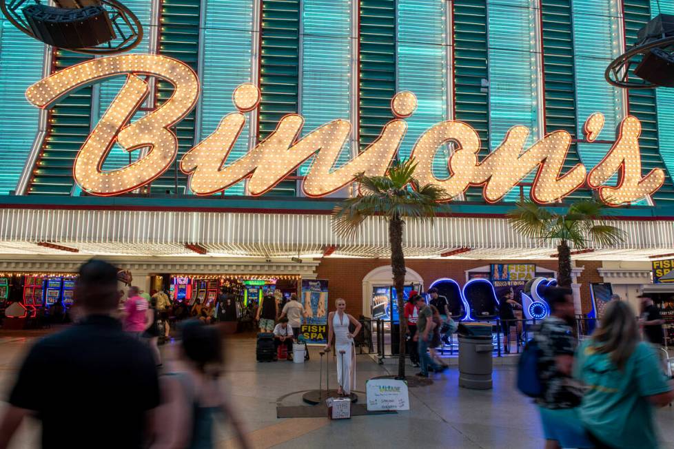 People walk through the Fremont Street Experience on Tuesday, July 5, 2022. City leaders are co ...
