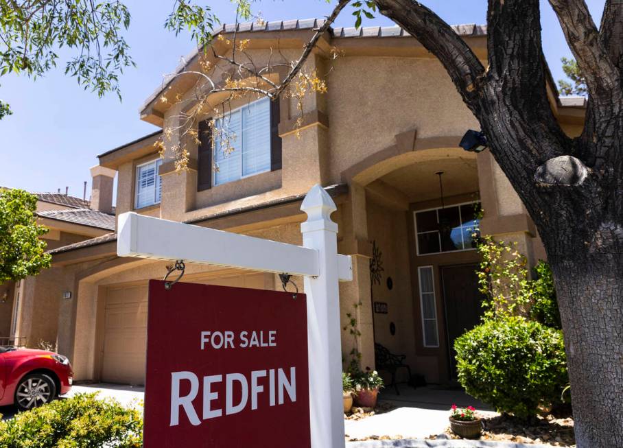 A Redfin for sale sign is posted outside a single family house on Wednesday, June 15, 2022, in ...