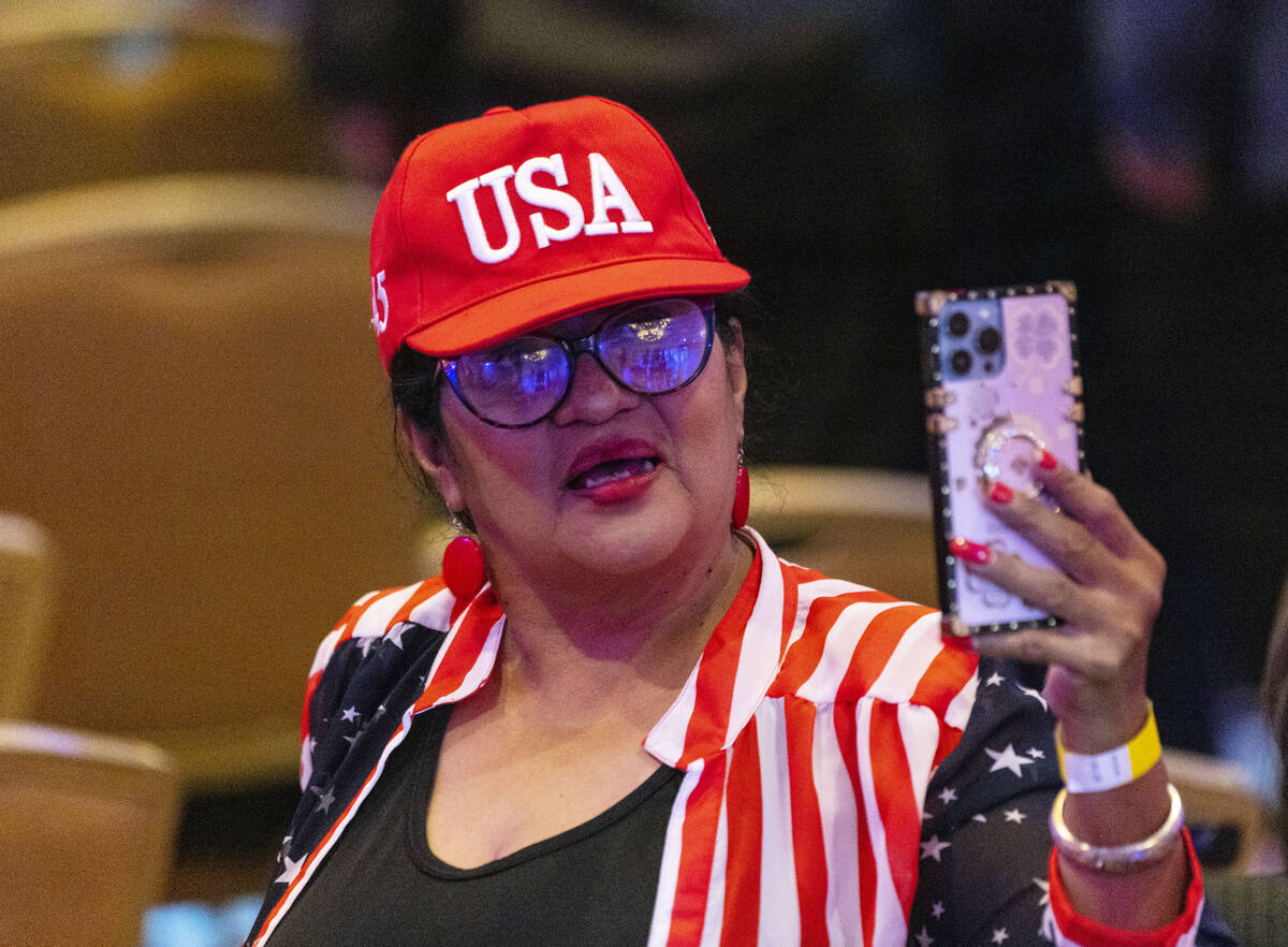 Rosemary Flores, a Hispanic community activist, takes a selfie during the Republican Party camp ...