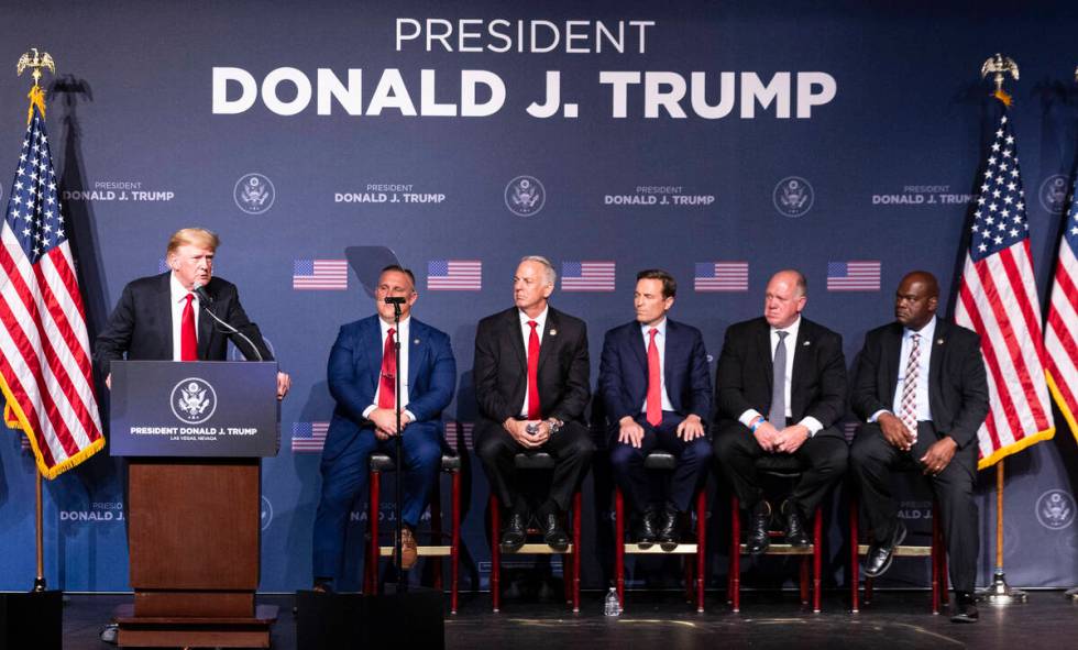 Former President Donald Trump speaks as Steve Grammas, second left, president of the Las Vegas ...