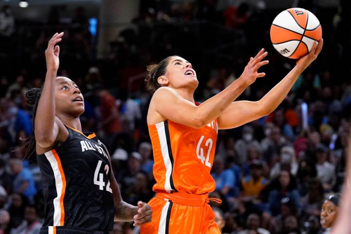 Team Wilson's Kelsey Plum, right, drives to the basket past Team Stewart's Jewell Loyd during t ...