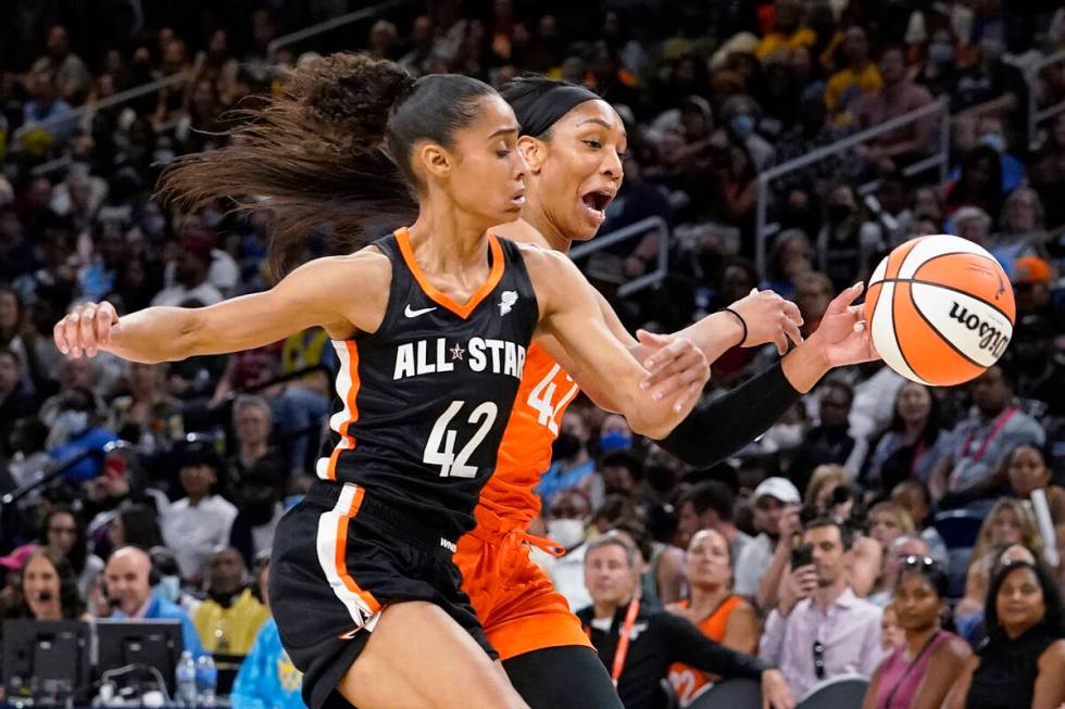 Team Stewart's Skylar Diggins-Smith, left, and Team Wilson's A'ja Wilson chase the ball during ...