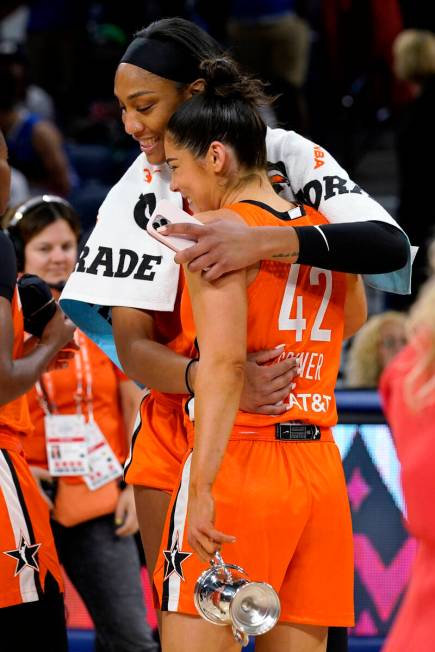 Team Wilson's Kelsey Plum, right, is congratulated by A'ja Wilson after Team Wilson defeated Te ...