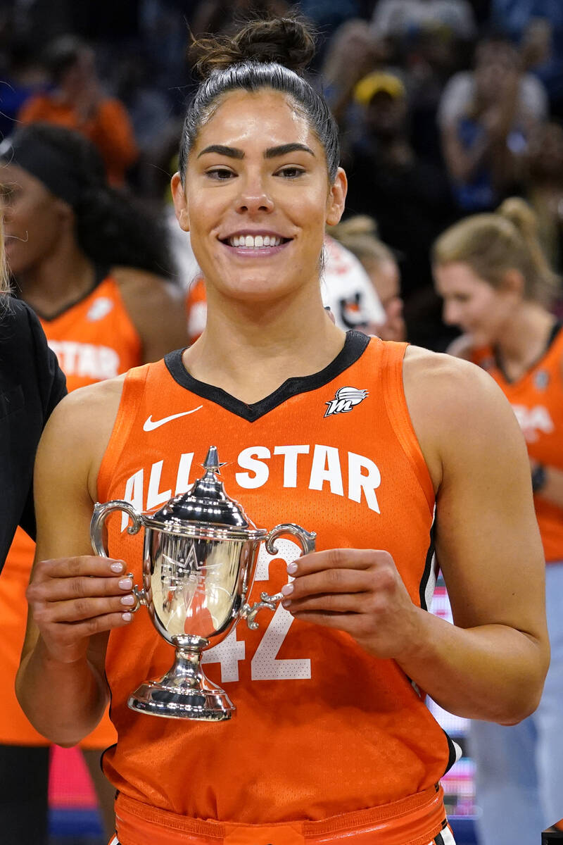 Team Wilson's Kelsey Plum holds up the MVP trophy after team Wilson defeated Team Stewart in a ...