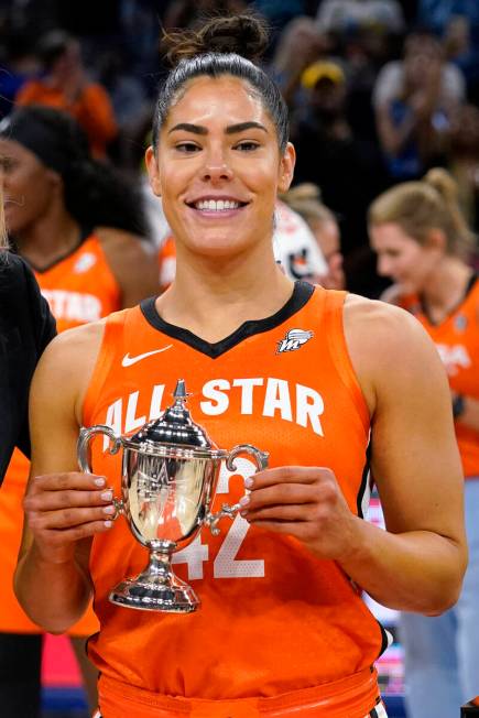 Team Wilson's Kelsey Plum holds up the MVP trophy after team Wilson defeated Team Stewart in a ...