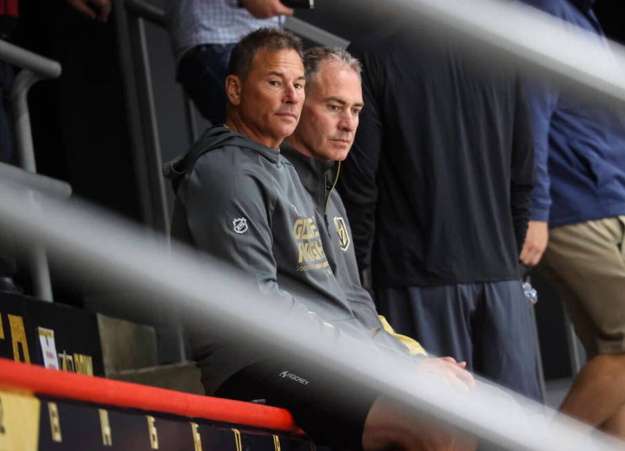 Golden Knights head coach Bruce Cassidy, left, looks on during development camp at City Nationa ...