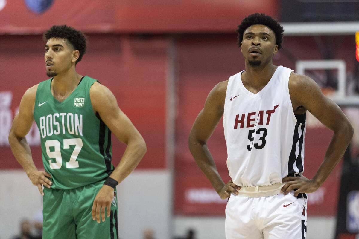 Miami Heat's Bryce Hamilton (53) waits for play to resume with Boston Celtics' Brodric Thomas ( ...