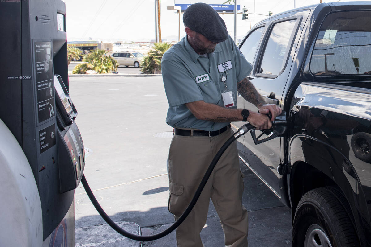 Albert Diaz pumps his gas at a Rebel station on North Rancho Drive on Tuesday, July 12, 2022, i ...