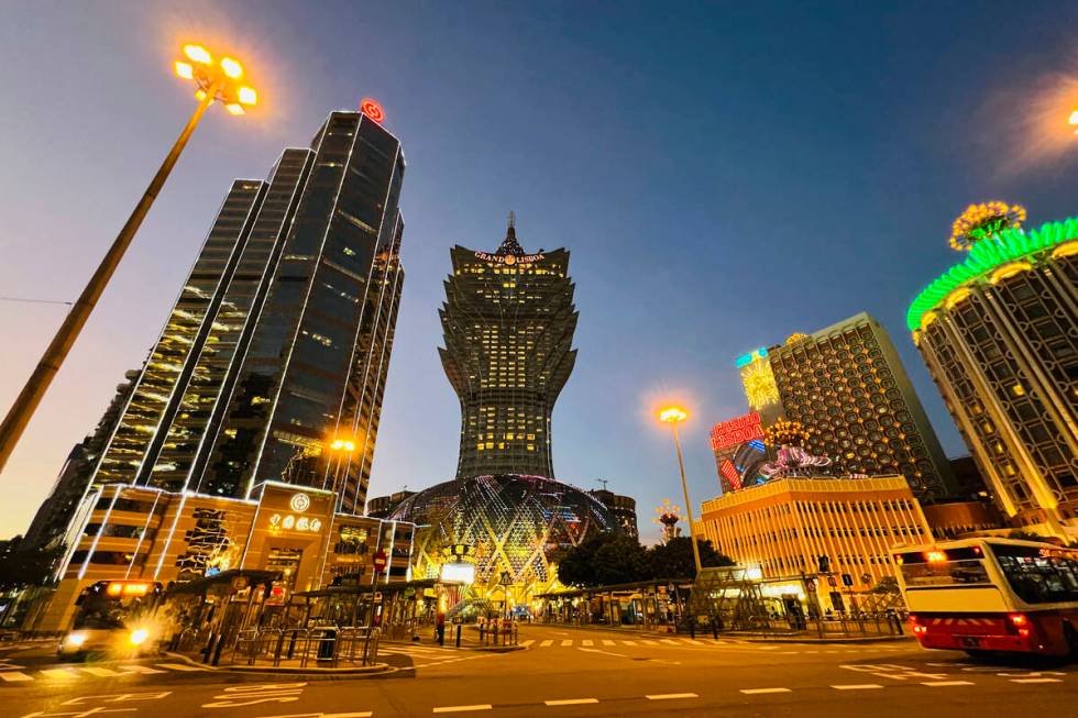 Grand Lisboa, center, is closed in Macao, Monday, July 11, 2022. Streets in the gambling center ...