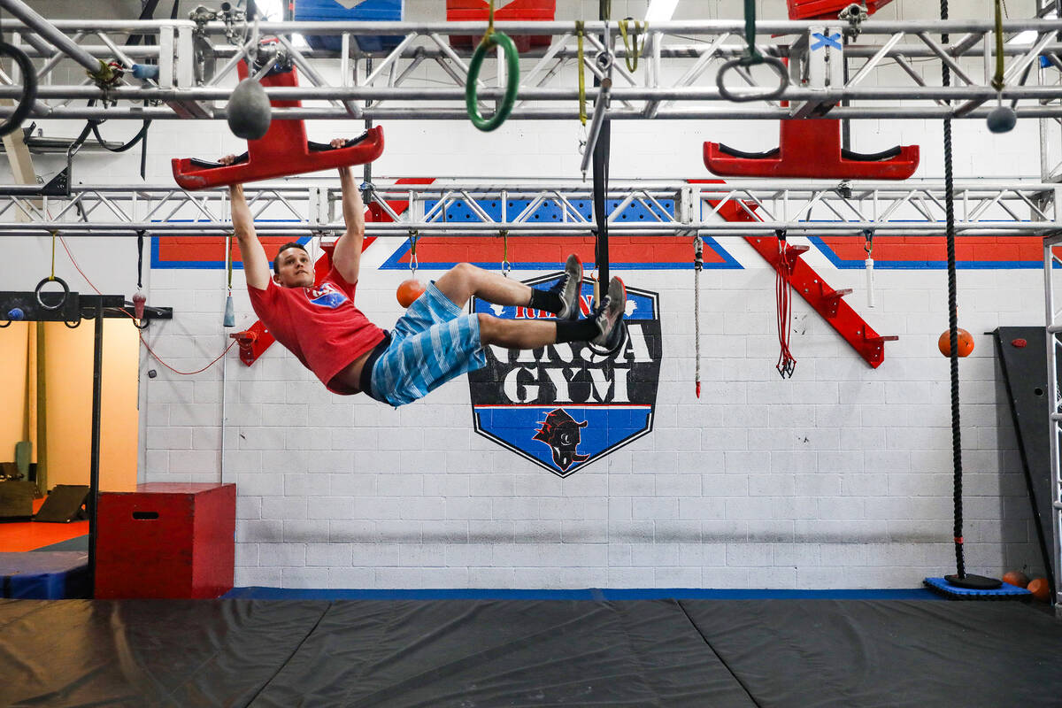 Manager Parker Gatewood shows how to perform the wingnuts obstacle at Rhino Ninja Gym in Las Ve ...