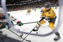 Minnesota Wild defenseman Jon Merrill (4) and Golden Knights left wing Max Pacioretty (67) batt ...