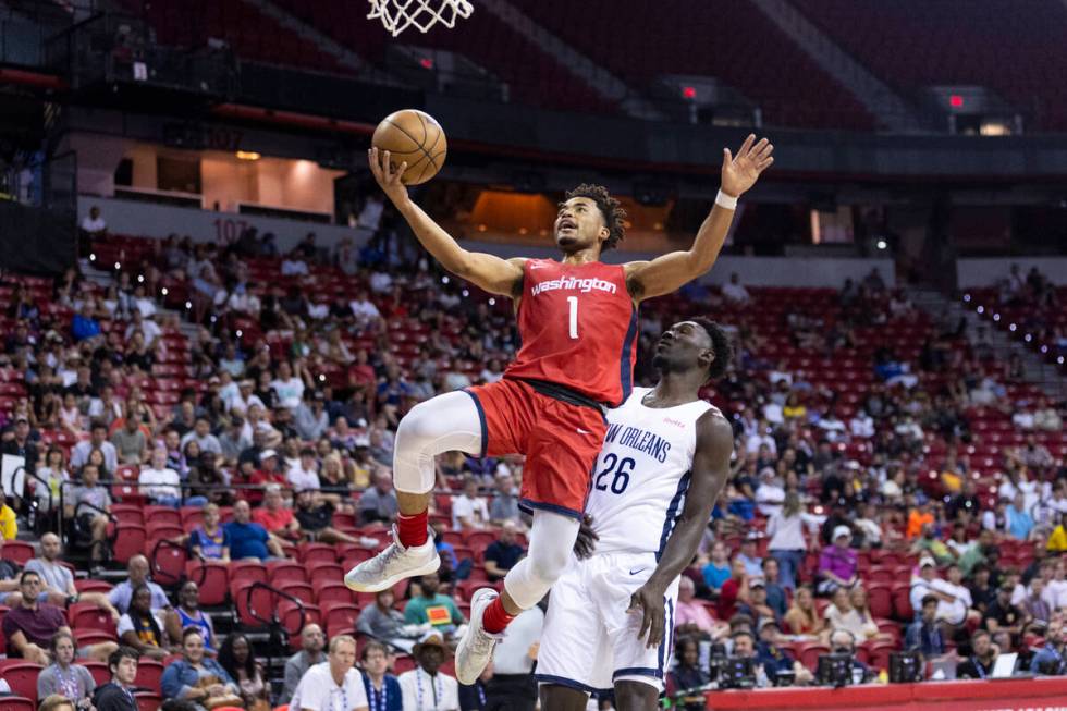 Washington Wizards' Devon Dotson (1) goes up for a shot as New Orleans Pelicans' Amadou Sow (26 ...
