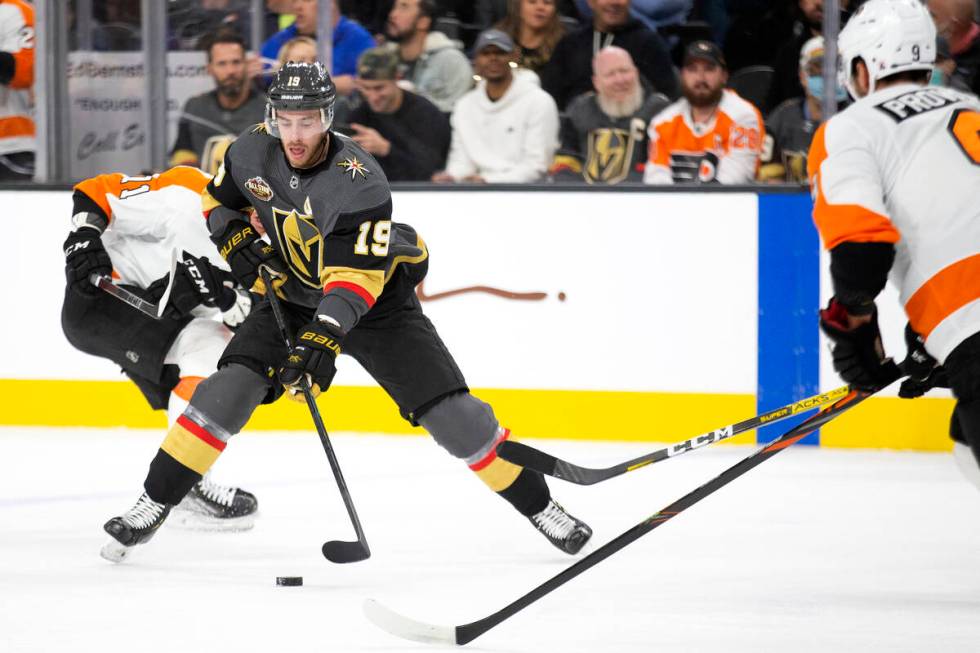 Golden Knights right wing Reilly Smith (19) skates with the puck as Flyers center Max Willman ( ...