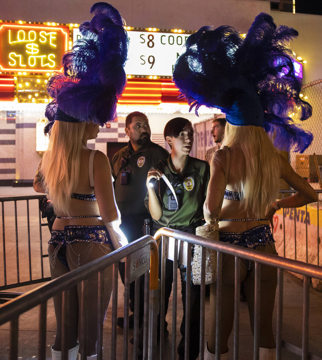 Buskers are screened before entering the Fremont Street Experience on Saturday, July 9, 2022, i ...