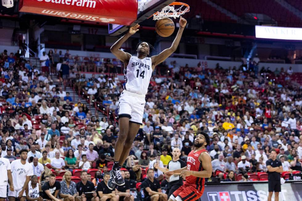 San Antonio Spurs Dominick Barlow (14) dunks the ball against the Houston Rockets during the fi ...