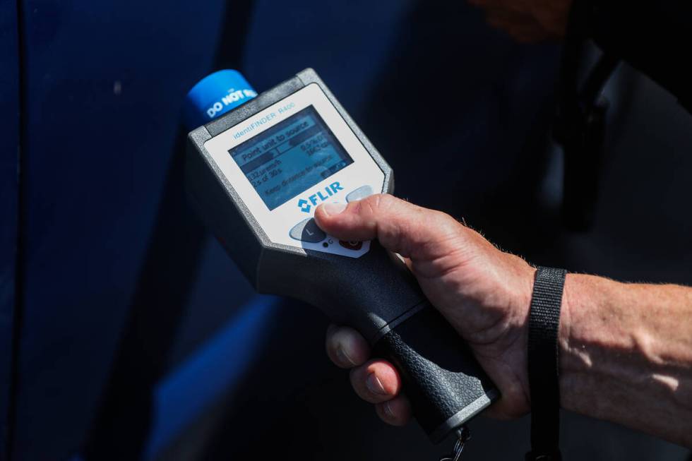 Luke Nelson, a North Las Vegas SWAT officer, holds a device used to identify a suspected radioa ...