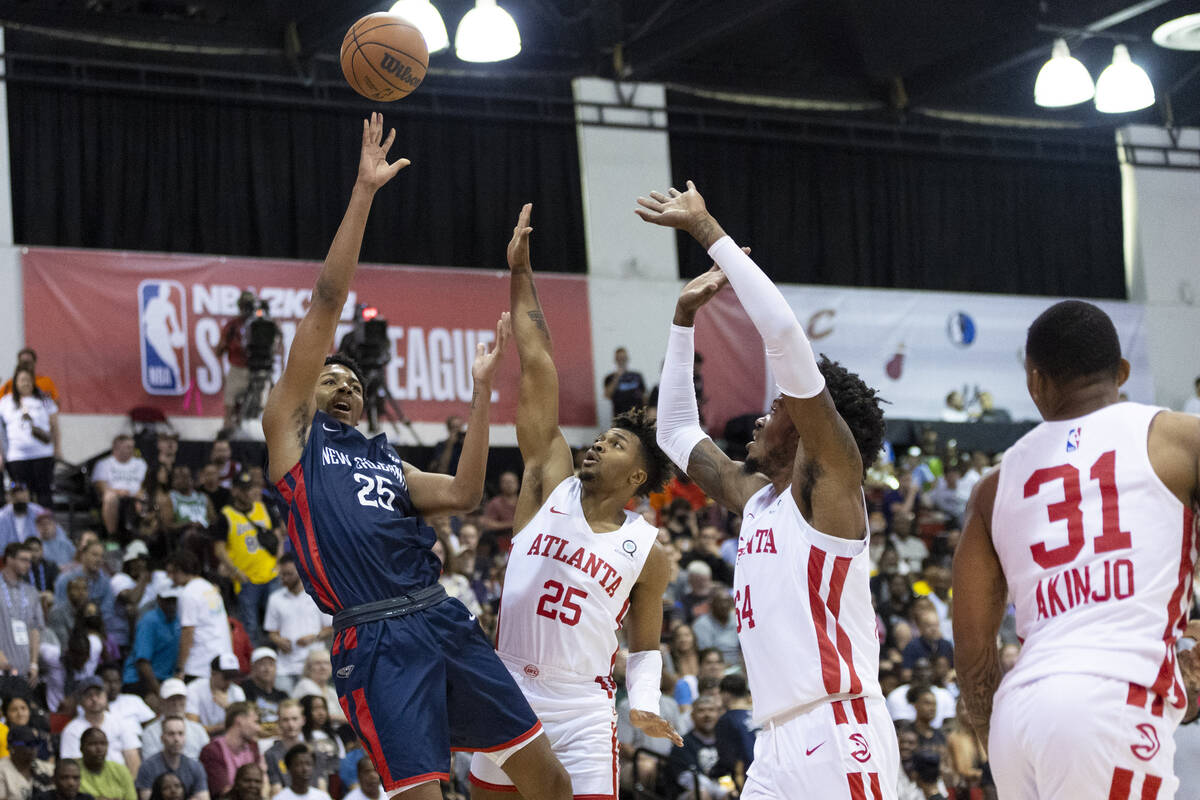 New Orleans Pelicans Trey Murphy III (25) takes a shot under pressure from Atlanta Hawks Tyson ...