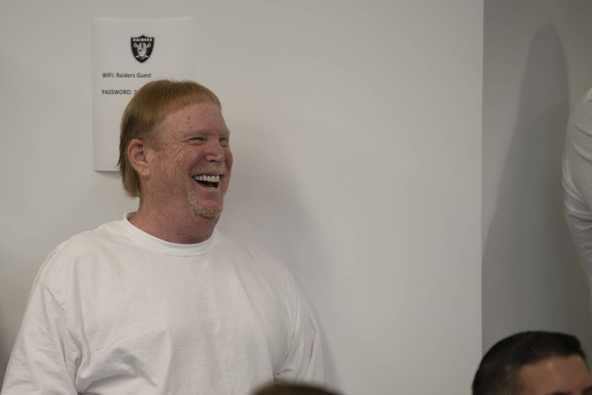 Las Vegas Raiders owner Mark Davis laughs during Richie Incognito's press conference to announc ...
